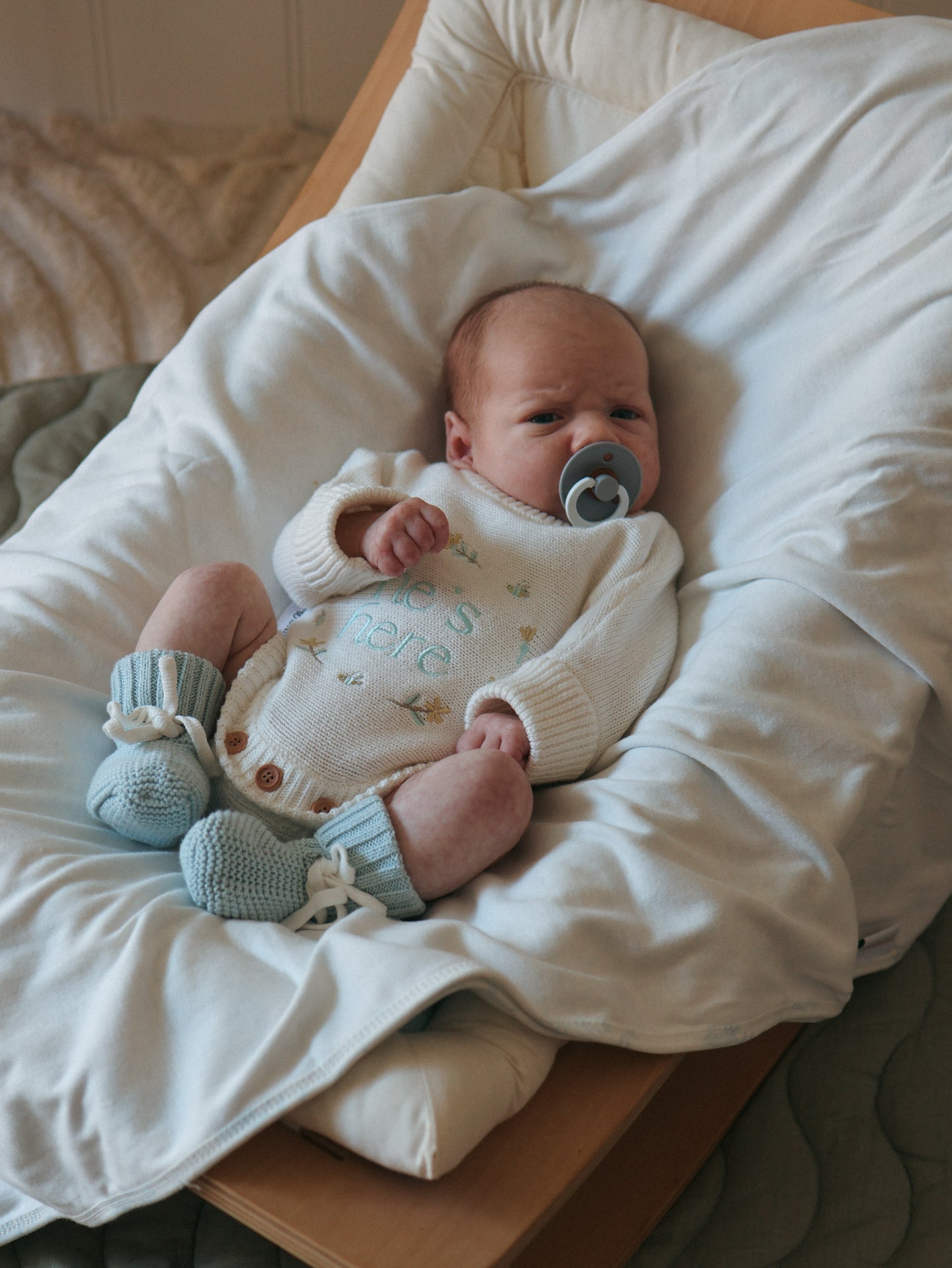 He’s Here Announcement Romper | Honey | Milk + Blue writing